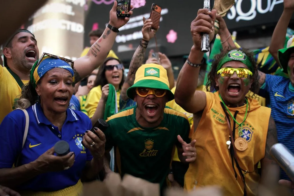 Group of passionate Brazilian fans singing and chanting together, woman in blue jersey with flag headwrap, men in green and yellow with phones raised