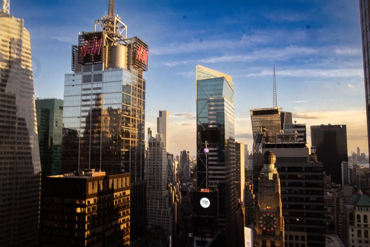 Wide angle view of Manhattan skyline at sunset with Times Square towers and Spotify building visible