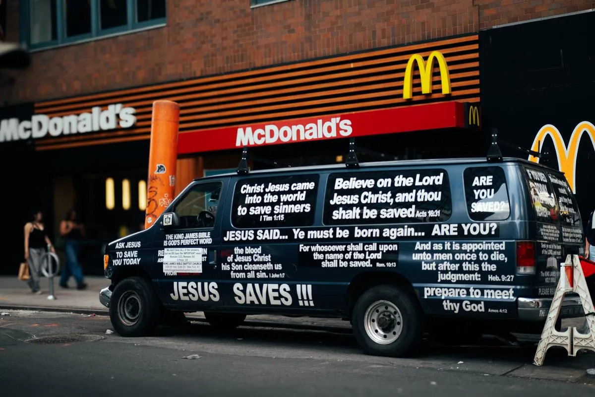 Van covered in religious scripture parked outside McDonald's in Times Square with pedestrians walking by